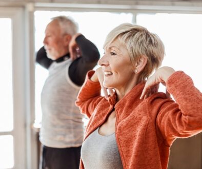 Older adults exercising at home as part of a healthy and active retirement routine.